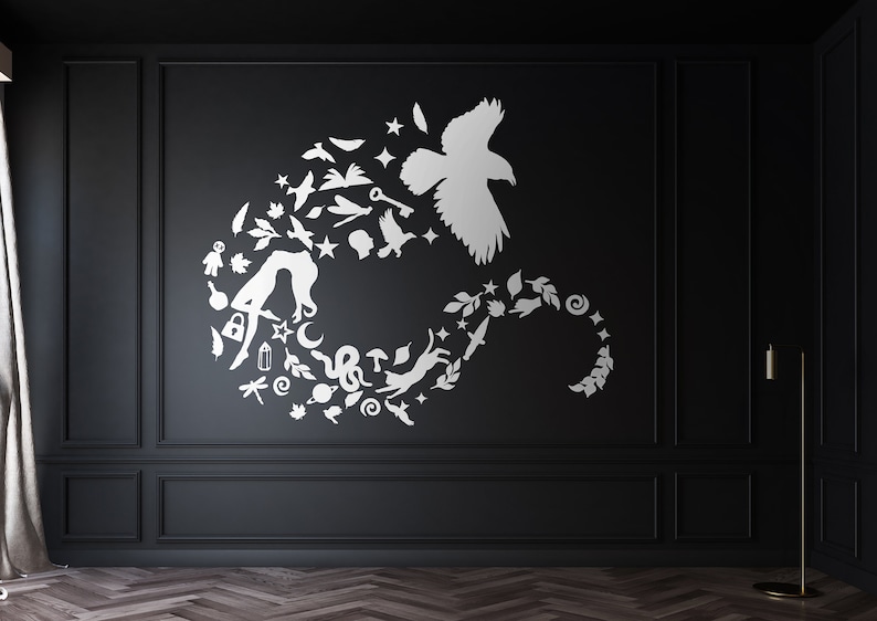 May include: A white silhouette of a bird with wings spread, surrounded by a circle of smaller white silhouettes of various objects, including a cat, a snake, a mushroom, a key, a crescent moon, and a dragonfly, on a black background.