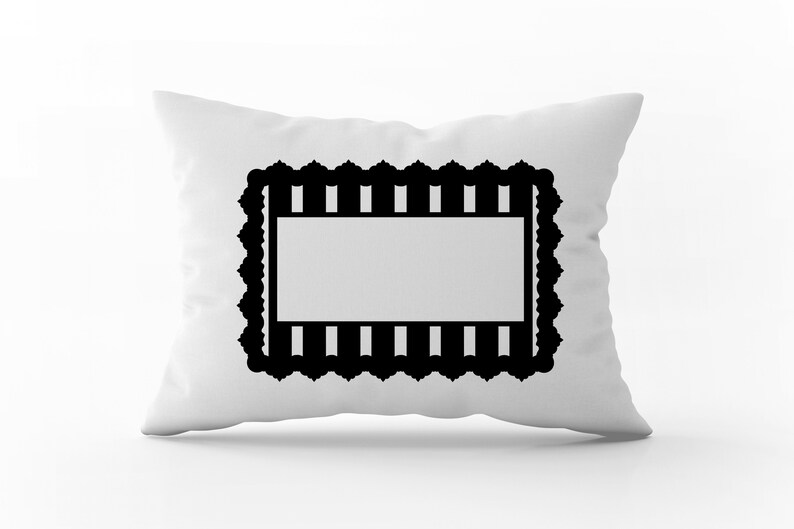 May include: White pillow with a black decorative frame. The frame has a scalloped edge and a striped pattern.