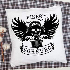 May include: White pillow with a black graphic of a skull riding a motorcycle with wings and the text "Biker Forever".