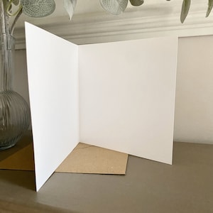 The inside of the greeting card features a blank interior, allowing the sender to include a personal message for the recipient.