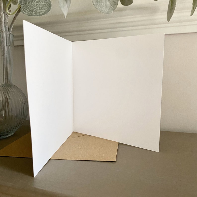 The inside of the greeting card features a blank interior, allowing the sender to include a personal message for the recipient.