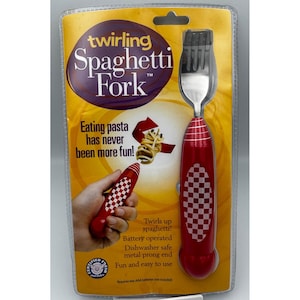 May include: A red and white checkered twirling spaghetti fork in a clear plastic package. The fork has a red handle with a white checkered pattern. The packaging includes the text "Twirling Spaghetti Fork" and "Eating pasta has never been more fun!"