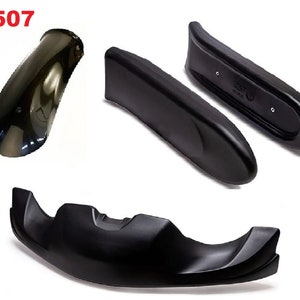 May include: A set of four black plastic motorcycle fairings. The fairings are designed to protect the rider from wind and debris. The fairings are made of high-quality plastic and are durable and long-lasting.