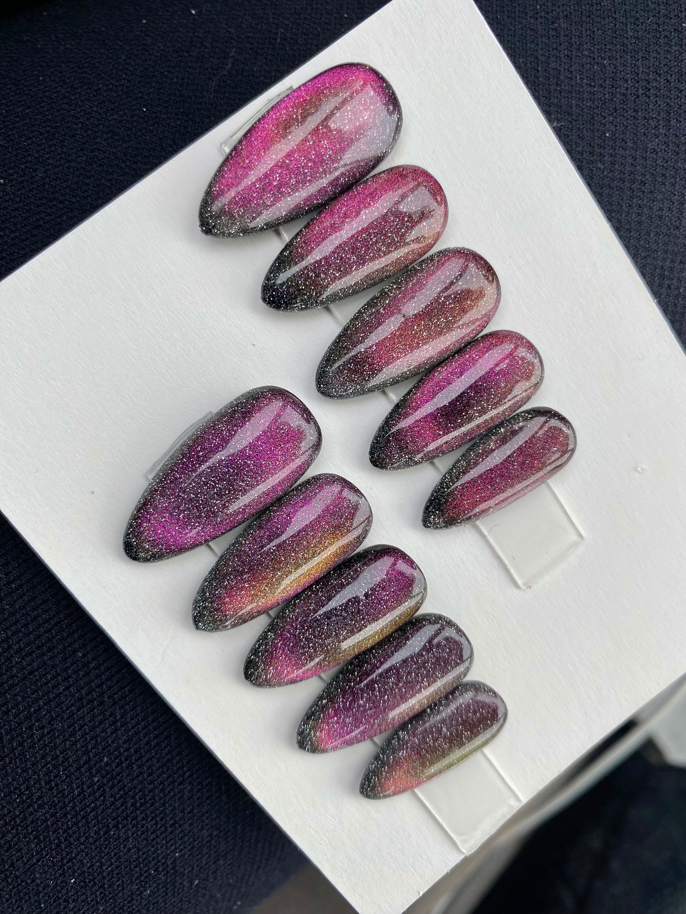 Aurora pigment and Swarovski crystals sculpted gel stiletto nails