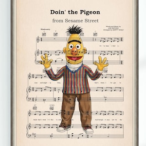 Peut inclure: Impression encadrée de Bert de Sesame Street, devant une partition musicale. Le texte "Doin' the Pigeon from Sesame Street" est visible. Bert porte une chemise rayée, un pantalon marron et des chaussures blanches.