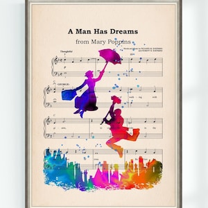 May include: Framed print featuring sheet music with watercolor silhouettes of characters from Mary Poppins. The title "A Man Has Dreams" is displayed at the top. The silhouettes are in shades of purple, blue, orange, and red.