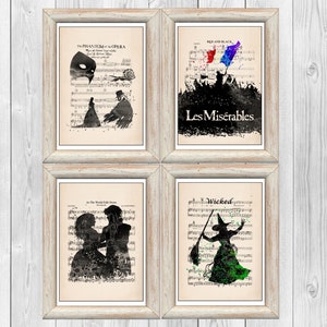 May include: Four framed prints of musical silhouettes on sheet music backgrounds. The prints feature the Phantom of the Opera, Les Miserables, Wicked, and Beauty and the Beast.