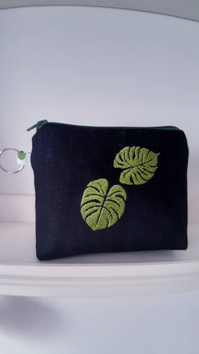 Handmade PRIMULA pochette made of denim fabric with machine embroidery detail