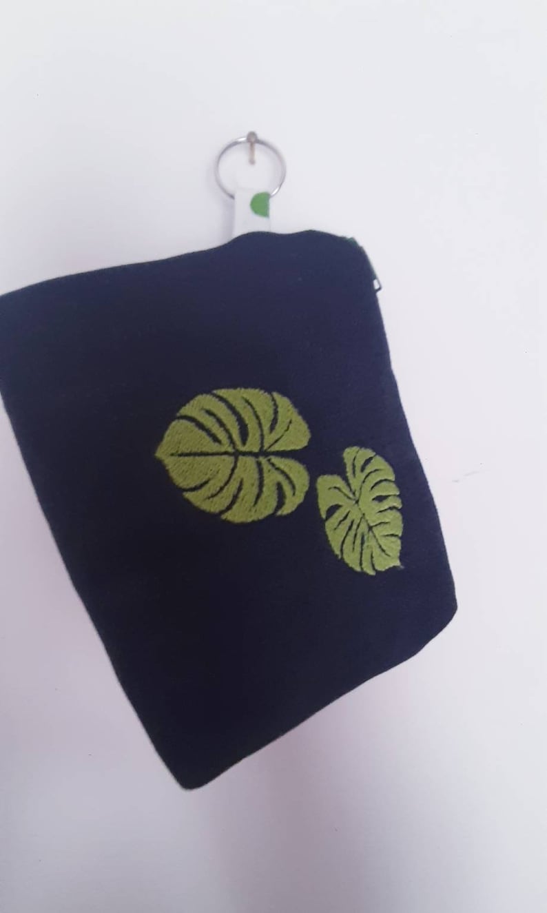 Handmade PRIMULA pochette made of denim fabric with machine embroidery detail