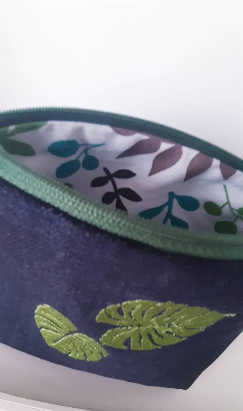 Handmade PRIMULA pochette made of denim fabric with machine embroidery detail