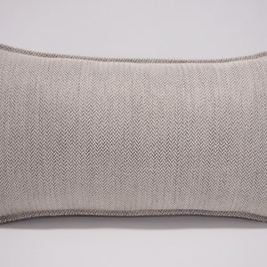 May include: A beige rectangular pillow with a subtle herringbone pattern and a white border.