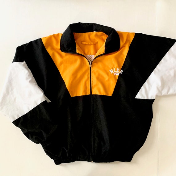 white and gold nike jacket
