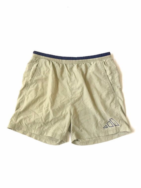 beige swim shorts