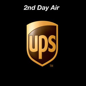 May include: UPS 2nd Day Air logo with the words "UPS" in gold lettering on a brown shield shape with a gold outline. The logo is on a black background with the trademark symbol "TM" below the shield.