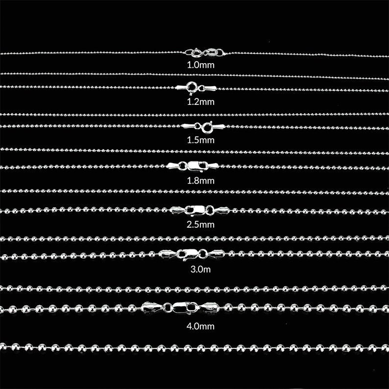 May include: A set of silver ball chain necklaces in various sizes, ranging from 1.0mm to 4.0mm. Each chain is displayed on a black background.