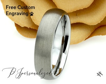 May include: A silver ring with a brushed finish, set against a white background with a floral accent. The ring has a polished interior. Text on the image reads "Free Custom Engraving" and "PJ Personalized".