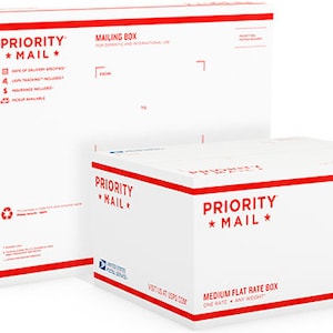 May include: Two white Priority Mail boxes. The larger box is a mailing box and the smaller box is a medium flat rate box. Both boxes have red and blue accents and the text "Priority Mail" printed on them.