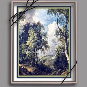 May include: A framed landscape painting depicting a lush green forest with a winding path leading through the trees. The sky is a bright blue with fluffy white clouds. The painting is in a light pink frame with a dark blue mat.