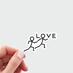May include: A sticker with a stick figure couple holding hands and the word "LOVE" above them.