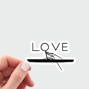 May include: A black and white sticker featuring a stick figure rowing a boat. The word "LOVE" is positioned above the figure.