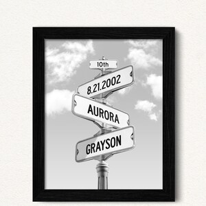 May include: Black and white photo of a street sign with the names "Grayson", "Aurora", "8.21.2002", and "10th" on it.