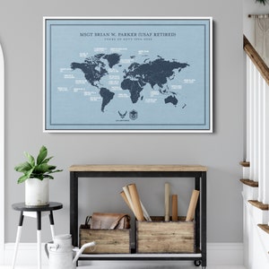 May include: A blue and white world map print with the text "MSGT BRIAN W. PARKER (USAF RETIRED) TOURS OF DUTY 1994-2022" and a US Air Force logo. The map shows various locations around the world.