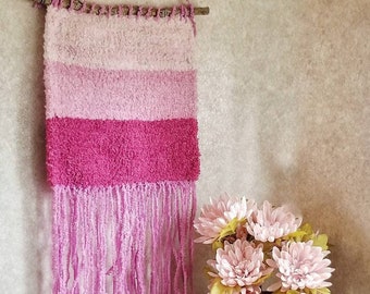 Hand woven wall hanging in pink