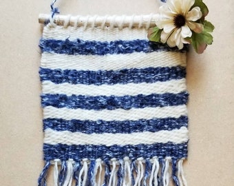 Handwoven wall hanging in blue and cream