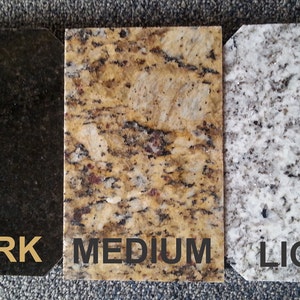 May include: Three granite samples, one dark, one medium, and one light. The samples are labeled "DARK", "MEDIUM", and "LIGHT".