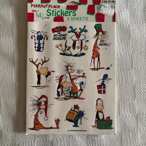 May include: A package of four sheets of MarketPlace Opus n Bill stickers featuring various cartoon characters in holiday themes. The stickers include text such as Rosebud the Red-Nosed Basselope, Bah! Hairball, and Holiday Pekled Stinkys.