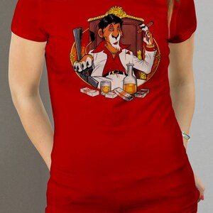 May include: A red t-shirt with a cartoon lion wearing a white suit and holding a cigar. The lion is sitting on a throne with money and a bottle of liquor in front of him.