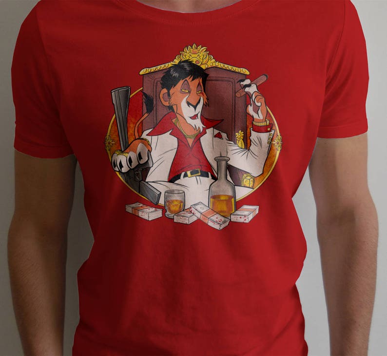 May include: Red t-shirt with a cartoon illustration of a lion wearing a red shirt, gold chain, and a crown. The lion is holding a glass of liquor and a cigar. The lion is sitting on a throne with money scattered around him.
