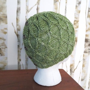 Side view of a knitted hat with buttons