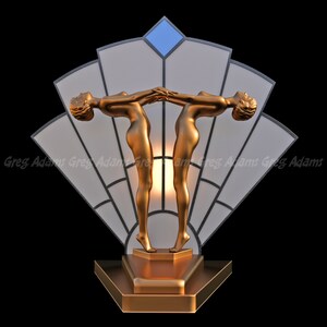 May include: A gold-toned Art Deco sculpture featuring two stylized figures with outstretched arms, their hands touching. The figures are set against a fan-shaped backdrop with a geometric design, and a blue diamond at the top. The sculpture is on a tiered base.