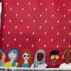 May include: A red fabric with a repeating pattern of yellow lightning bolts.  The bottom of the fabric features a row of diverse women wearing sunglasses and hats. The text "Mask Love ©2020 All Rights Reserved. www.RileyBlakeDesigns.com" is printed at the bottom of the fabric.