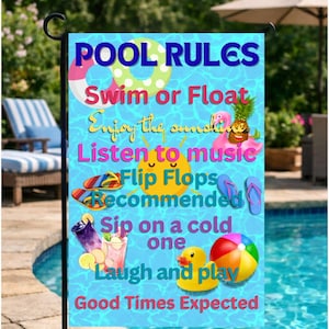 May include: A garden flag with the words "POOL RULES" in blue and other colorful text and graphics. The flag includes phrases like "Swim or Float," "Enjoy the sunshine," and "Laugh and play."