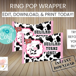 May include: Printable Ring Pop wrapper featuring a black and white cow print design with pink accents. The wrapper says "Delilah Turns One!" and includes the Ring Pop logo.