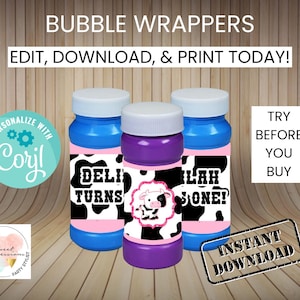 May include: Printable bubble bottle wrappers with a cow print design. The wrappers are pink, blue, and purple with black cow spots. The text on the wrappers says "Deli Turns One!" and "Lah One!"