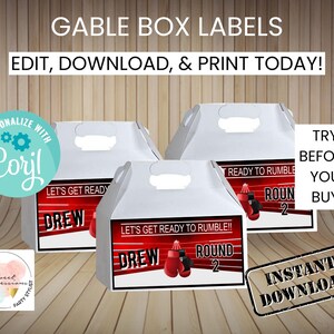 May include: Three white gable boxes with red and black labels. The labels feature a boxing theme with the text "Let's Get Ready to Rumble!" and "Round 2". The boxes are for a birthday party.