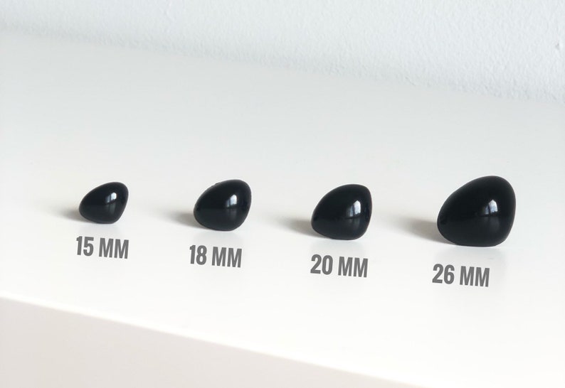 May include: Four black plastic safety eyes in different sizes: 15 mm, 18 mm, 20 mm, and 26 mm.