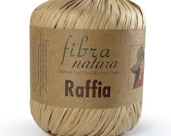 May include: A ball of natural raffia yarn in a brown colour. The yarn is labelled "fibra natura" and "Natural Fine Hand Knitting Yarns".