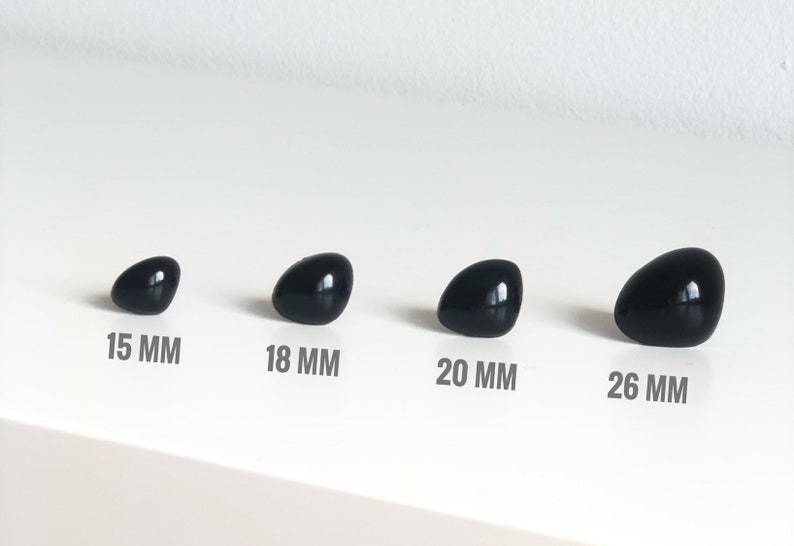 May include: Four black plastic safety eyes in different sizes: 15 mm, 18 mm, 20 mm, and 26 mm.