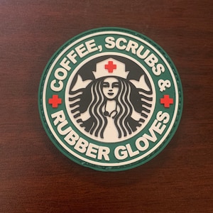 May include: Green and white embroidered patch with a stylized coffee cup logo and the text "Coffee, Scrubs & Rubber Gloves".