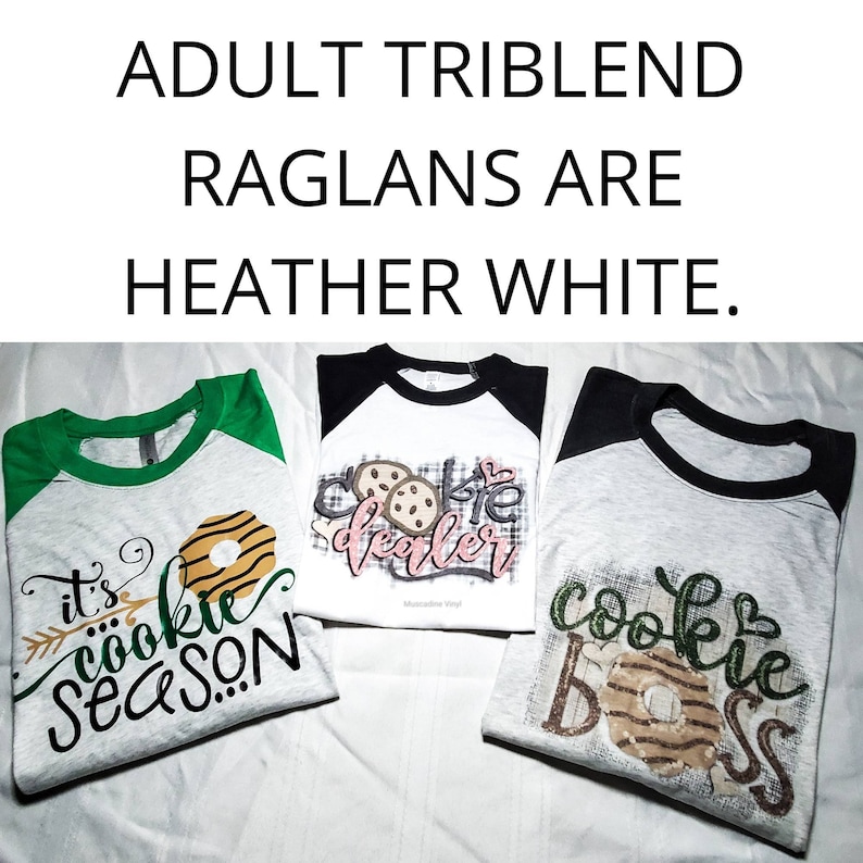 May include: Three heather white raglan shirts with different designs. One has green sleeves and the text "it's cookie season". Another has black sleeves and the text "cookie dealer". The third has black sleeves and the text "cookie boss".