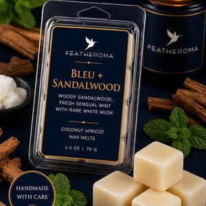 May include: A dark blue box of wax melts labeled "BLEU + SANDALWOOD" with the brand name "FEATHEROMA". The description includes "WOODY SANDALWOOD, FRESH SENSUAL MINT WITH RARE WHITE MUSK". A lit candle and sprigs of mint are also visible.