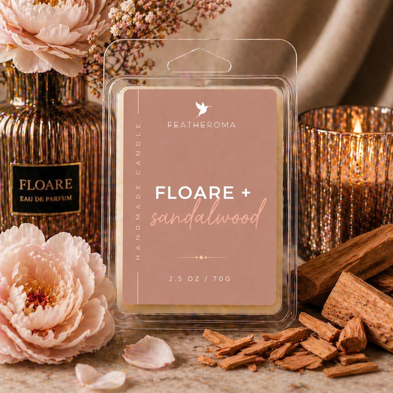 May include: A clear plastic clamshell package containing a wax melt with the text "FLOARE + sandalwood" and "2.5 OZ / 70G". The package is surrounded by a perfume bottle, flowers, a lit candle, and sandalwood pieces.