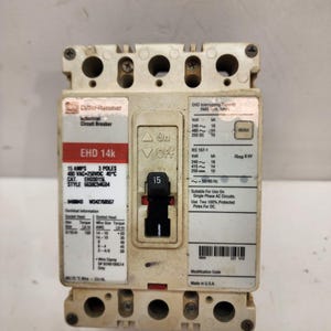 May include: A beige Cutler-Hammer EHD 14k industrial circuit breaker with a black on/off switch. The breaker is rated for 15 amps and 3 poles. Text on the device includes voltage and frequency specifications, and it is made in the USA.