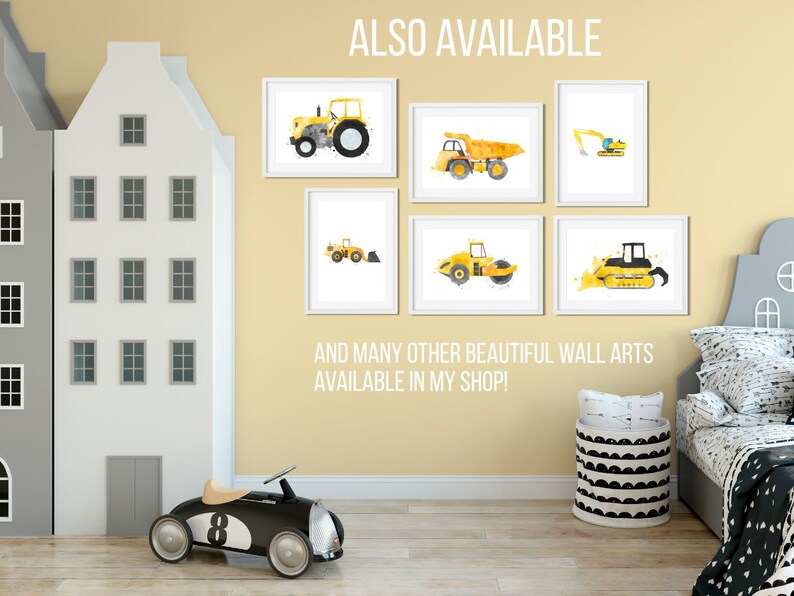 May include: A set of six yellow construction vehicle prints with white frames. The prints feature a tractor, dump truck, excavator, roller, bulldozer, and backhoe. The prints are displayed on a wall in a nursery with a toy car and a toy house.
