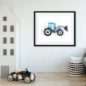 May include: A framed watercolor painting of a blue tractor with a black and white splatter background. The tractor is facing right and has a black bucket.