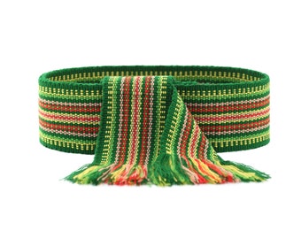 May include: A green, yellow, and red striped woven belt with fringe ends.